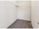 Carpeted walk-in closet featuring white walls and metal shelving for optimal storage at 2236 Willowview Dr, Indianapolis, IN 46239