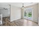 Dining room with wood floors, neutral paint, and French doors leading to the backyard at 2236 Willowview Dr, Indianapolis, IN 46239