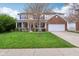 Charming two-story home with brick and siding, lush lawn, and attached two car garage at 2236 Willowview Dr, Indianapolis, IN 46239