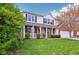 Lovely home featuring a cozy front porch and well-maintained lawn surrounded by lush greenery at 2236 Willowview Dr, Indianapolis, IN 46239