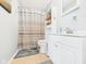 Bathroom featuring a shower with a patterned curtain, vanity, and built-in storage at 2329 E 8Th St, Anderson, IN 46012