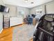Bedroom featuring hardwood floors, neutral paint, and a massage chair at 2329 E 8Th St, Anderson, IN 46012