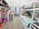 Bright bedroom with carpet, a bunk bed, and a playful decor at 2329 E 8Th St, Anderson, IN 46012
