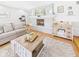 Cozy living room with a painted fireplace, hardwood floors, and comfortable seating at 2329 E 8Th St, Anderson, IN 46012