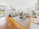 Bright living room with hardwood floors, neutral decor, and plenty of natural light at 2329 E 8Th St, Anderson, IN 46012