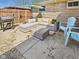 Outdoor patio area featuring comfortable seating, a grill, and an umbrella for shade at 2329 E 8Th St, Anderson, IN 46012