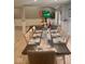 Bright dining room with a large table, seating for ten, and wainscotting at 2517 Horton Dr, Anderson, IN 46011