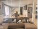 Open concept living room flowing to the dining room, complete with a large sectional sofa at 2517 Horton Dr, Anderson, IN 46011