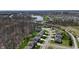 Scenic aerial view of houses nestled in a well-planned community surrounded by lush greenery and a pond at 267 Westbrook Ct, Columbus, IN 47201