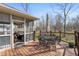 Deck with outdoor dining area and a screened porch with views of the backyard at 267 Westbrook Ct, Columbus, IN 47201