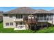 Backyard showcases tiered deck and screened porch, ideal for relaxation at 267 Westbrook Ct, Columbus, IN 47201