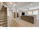 Finished basement with neutral carpeting, a large sectional sofa, and a built-in media center at 267 Westbrook Ct, Columbus, IN 47201