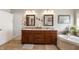 Elegant bathroom featuring a double vanity, soaking tub, and modern fixtures at 267 Westbrook Ct, Columbus, IN 47201