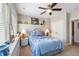 Cozy bedroom featuring a ceiling fan, window seat, and wicker furniture at 267 Westbrook Ct, Columbus, IN 47201