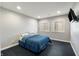 Simple bedroom features two sunny windows and blue bedding at 267 Westbrook Ct, Columbus, IN 47201