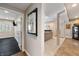 Hallway leads to living area, showcasing neutral paint and elegant decor at 267 Westbrook Ct, Columbus, IN 47201