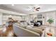 Inviting living room with hardwood floors, a fireplace, and an open layout leading to the kitchen area at 267 Westbrook Ct, Columbus, IN 47201