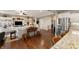 Open-concept kitchen and living area with modern appliances, hardwood floors, and built-in shelving at 267 Westbrook Ct, Columbus, IN 47201