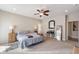 Cozy main bedroom boasting a ceiling fan, bay windows, and ample natural light at 267 Westbrook Ct, Columbus, IN 47201