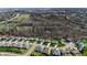Aerial view of a peaceful suburban neighborhood surrounded by lush greenery and mature trees at 267 Westbrook Ct, Columbus, IN 47201