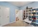 Functional office with a white bookshelf and desk, offering an organized workspace with neutral carpet at 267 Westbrook Ct, Columbus, IN 47201