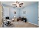 Bright office space with a ceiling fan, providing a dedicated workspace with natural light at 267 Westbrook Ct, Columbus, IN 47201