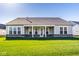Expansive backyard featuring a well-maintained lawn and a covered patio, ideal for outdoor enjoyment at 2779 Ruffian Dr, Westfield, IN 46074