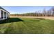 Lush backyard with manicured lawn and pond, offering a peaceful outdoor retreat at 2779 Ruffian Dr, Westfield, IN 46074