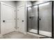 Modern bathroom featuring a glass-enclosed shower with gray tile and sleek fixtures at 2779 Ruffian Dr, Westfield, IN 46074