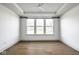 Bright bedroom with a ceiling fan, hardwood floors, and large windows with exterior views at 2779 Ruffian Dr, Westfield, IN 46074