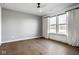 Bedroom with a ceiling fan, hardwood floors, large windows, and decorative curtains at 2779 Ruffian Dr, Westfield, IN 46074