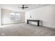 Spacious bonus room with carpet flooring, a modern ceiling fan, and natural light from a window at 2779 Ruffian Dr, Westfield, IN 46074