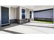 Cozy front porch showcasing seating next to the front door at 2779 Ruffian Dr, Westfield, IN 46074