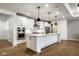 Modern kitchen boasts a large center island, stainless steel appliances, and hardwood floors at 2779 Ruffian Dr, Westfield, IN 46074
