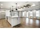 Bright, open-concept living area featuring wood floors, tray ceilings, and ample natural light at 2779 Ruffian Dr, Westfield, IN 46074