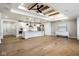 Open floorplan showcasing kitchen with island and living area with wood beams, hardwood floors and modern decor at 2779 Ruffian Dr, Westfield, IN 46074