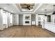 Bright living area with fireplace, hardwood floors, custom cabinetry, and modern decor at 2779 Ruffian Dr, Westfield, IN 46074