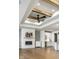 Living room with wood beam ceiling, fireplace, hardwood floors and custom cabinets at 2779 Ruffian Dr, Westfield, IN 46074