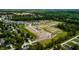 Expansive aerial view showcasing the new community with verdant greenery, walking trails and multiple homesites at 325 Atlas Dr, Lebanon, IN 46052