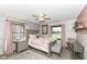 Cozy bedroom with brick accent wall, soft lighting, and comfortable furnishings at 3607 Windsor Way, Anderson, IN 46011