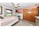 Relaxing bedroom with decorative wallpaper, a comfortable bed, and ample natural light at 3607 Windsor Way, Anderson, IN 46011
