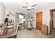 Bright bedroom with a ceiling fan, desk, and charming decor at 3607 Windsor Way, Anderson, IN 46011