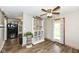Open dining room with wood floors, and a view to the backyard at 3607 Windsor Way, Anderson, IN 46011