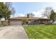Charming single-story brick home with a well-manicured lawn and attached two-car garage at 3607 Windsor Way, Anderson, IN 46011
