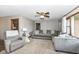 Comfortable living room featuring neutral tones, natural light, and cozy seating arrangements at 3607 Windsor Way, Anderson, IN 46011