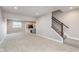 Finished basement with neutral carpet and wood staircase at 3728 Dunellen Cir, Carmel, IN 46074