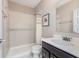 Bathroom featuring a tiled shower with a glass door, modern vanity, and updated fixtures at 3728 Dunellen Cir, Carmel, IN 46074