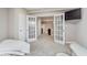 Bedroom with an open doorway view of the basement kitchenette and sitting area at 3728 Dunellen Cir, Carmel, IN 46074