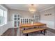 Bright dining room featuring a large table, bench, and elegant chandelier at 3728 Dunellen Cir, Carmel, IN 46074