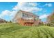 Exterior view of the home showcasing the deck, yard, and architectural details at 3728 Dunellen Cir, Carmel, IN 46074